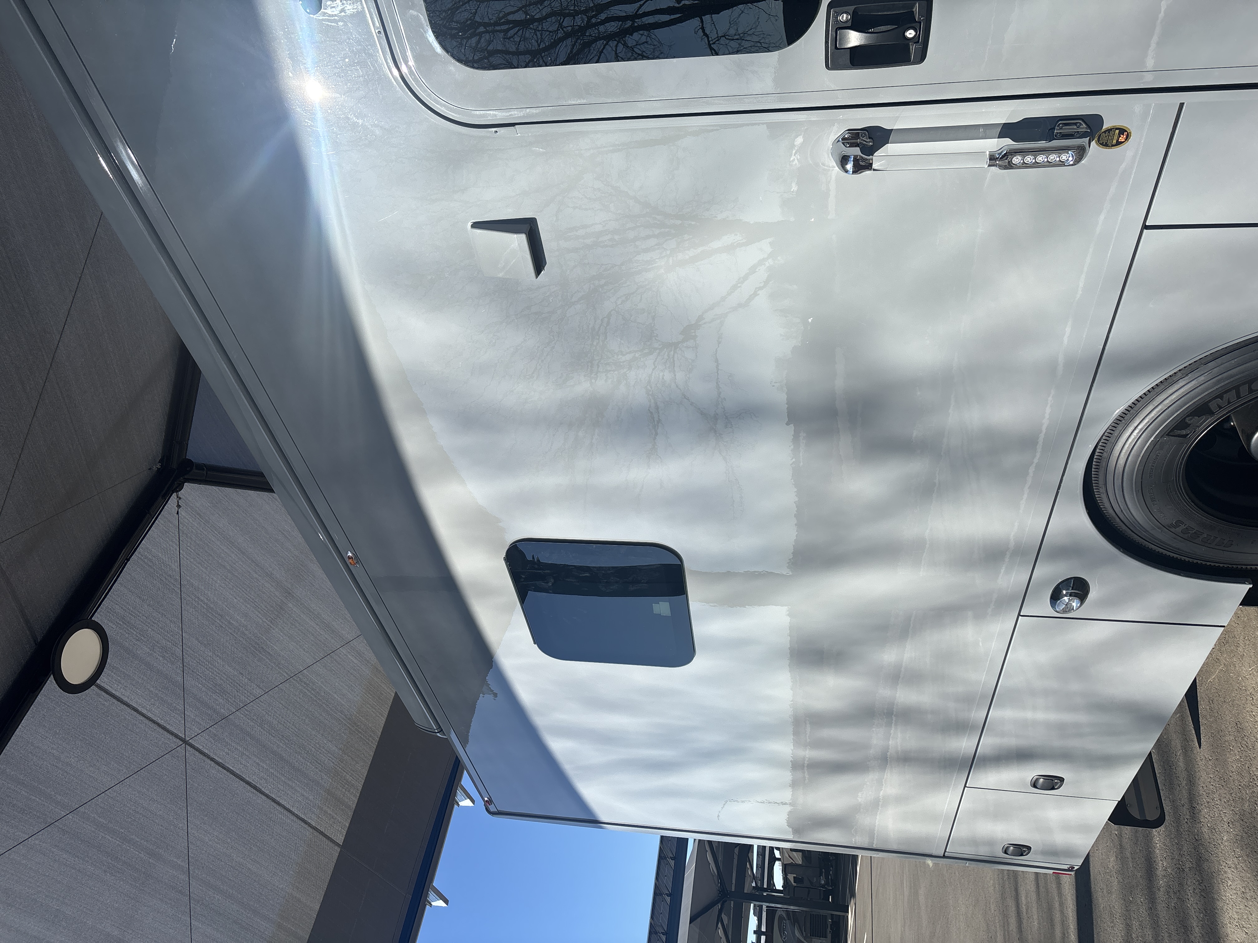 Before: RV exterior with heavy oxidation and UV damage