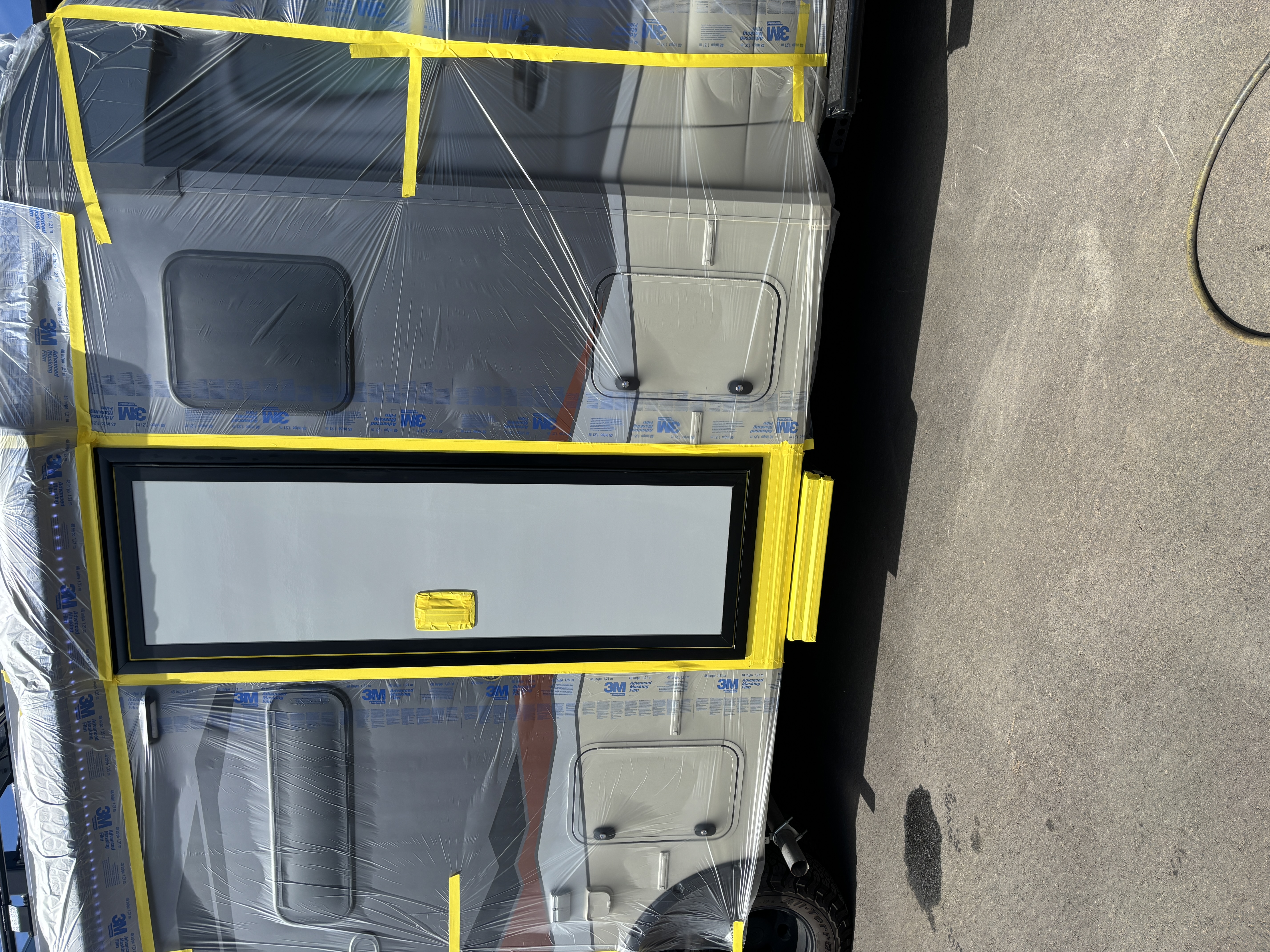 Before: Class A motorhome fully masked and prepped for paint